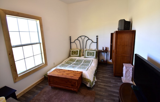 bedroom featuring dark hardwood / wood-style floors