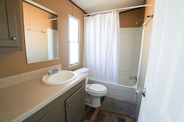 full bathroom featuring a healthy amount of sunlight, toilet, shower / bath combo with shower curtain, and vanity