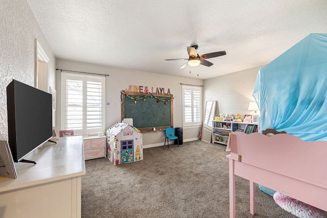 carpeted bedroom with baseboards, a textured ceiling, and ceiling fan