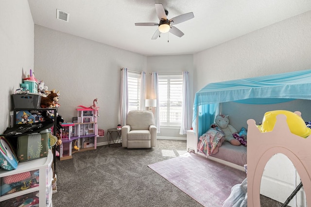 bedroom with a ceiling fan, carpet, visible vents, baseboards, and a textured wall