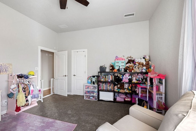 recreation room featuring visible vents, carpet floors, baseboards, and a ceiling fan