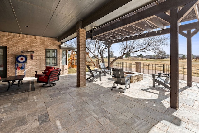 view of patio featuring an outdoor fire pit, a pergola, and fence