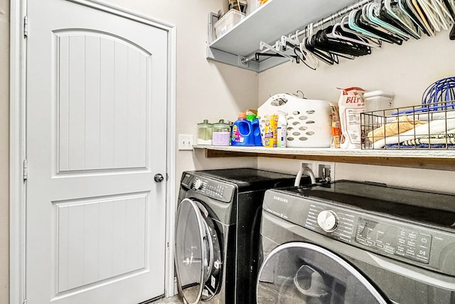 clothes washing area with independent washer and dryer