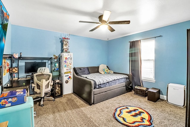 bedroom featuring ceiling fan and light carpet