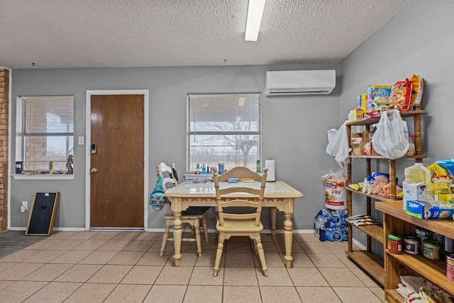 dining area featuring a wall mounted air conditioner and a textured ceiling