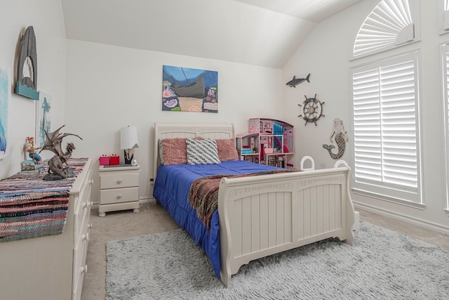 carpeted bedroom featuring vaulted ceiling