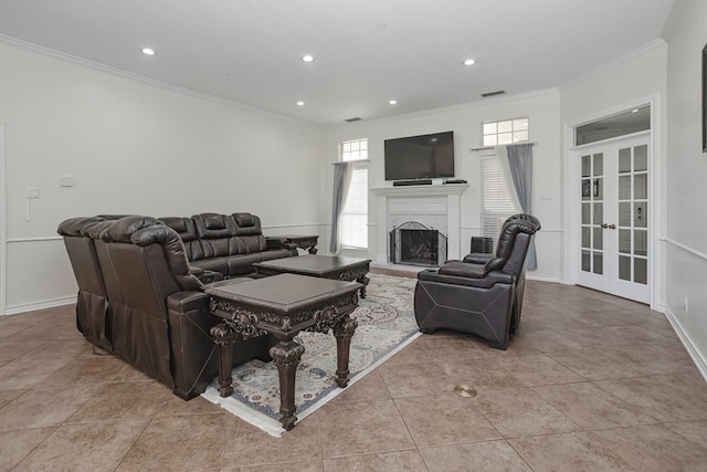 living room with french doors, ornamental molding, and light tile patterned floors