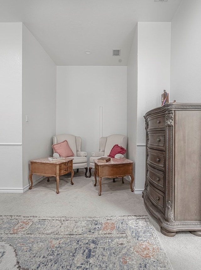 living area with light colored carpet