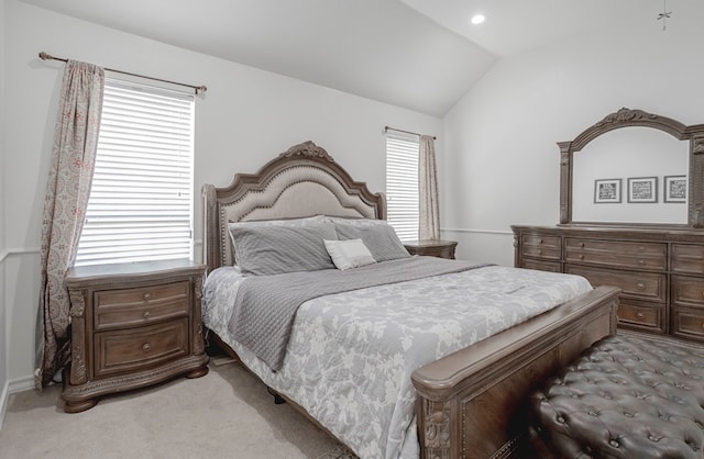 carpeted bedroom featuring vaulted ceiling