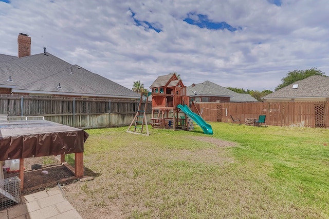 view of play area featuring a lawn