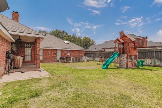 view of yard featuring a patio area and a playground