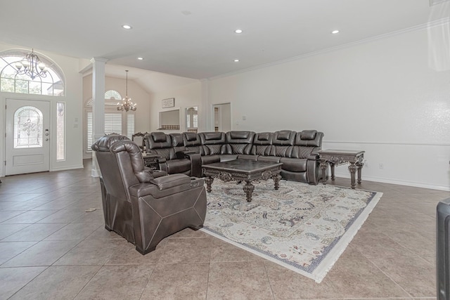 tiled living room featuring ornamental molding, vaulted ceiling, decorative columns, and a chandelier