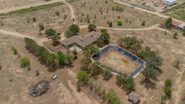 birds eye view of property with a rural view