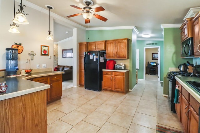 kitchen with ornamental molding, decorative light fixtures, light tile patterned floors, and black appliances