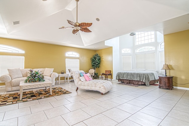 tiled bedroom featuring ceiling fan and lofted ceiling