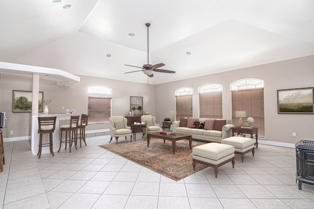 living room featuring vaulted ceiling, ceiling fan, and light tile patterned flooring