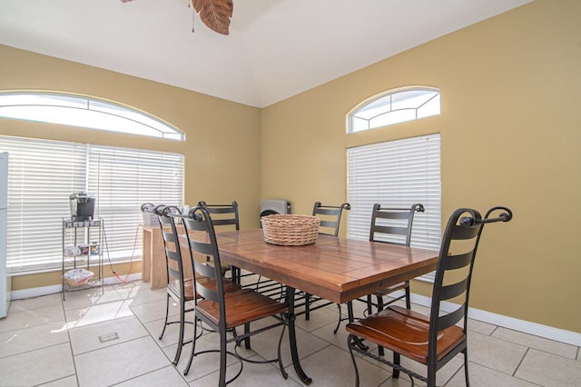 dining room with ceiling fan and light tile patterned flooring