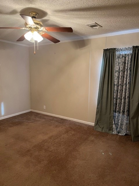 carpeted spare room featuring crown molding, ceiling fan, and a textured ceiling