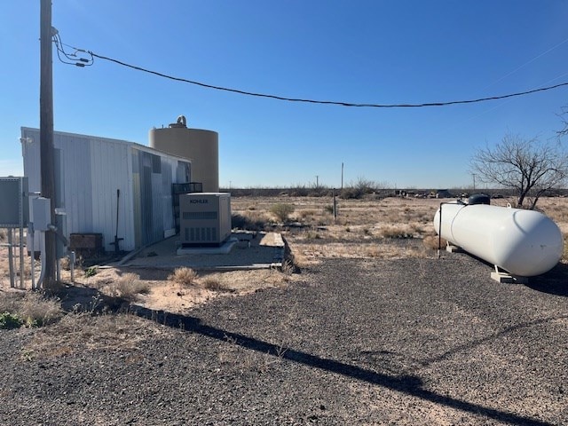 view of yard featuring central air condition unit