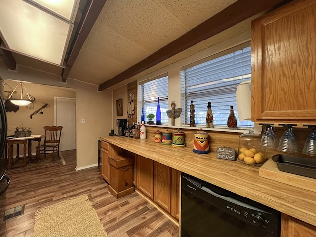 bar featuring light wood-type flooring, black dishwasher, and wooden counters