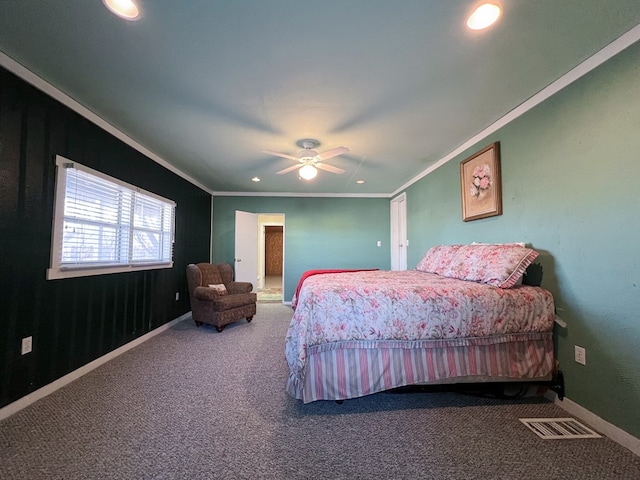 carpeted bedroom featuring ceiling fan and crown molding