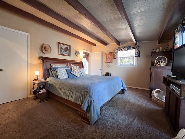 bedroom with carpet floors and beamed ceiling