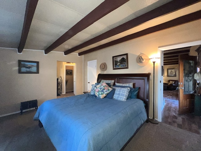 bedroom featuring beamed ceiling