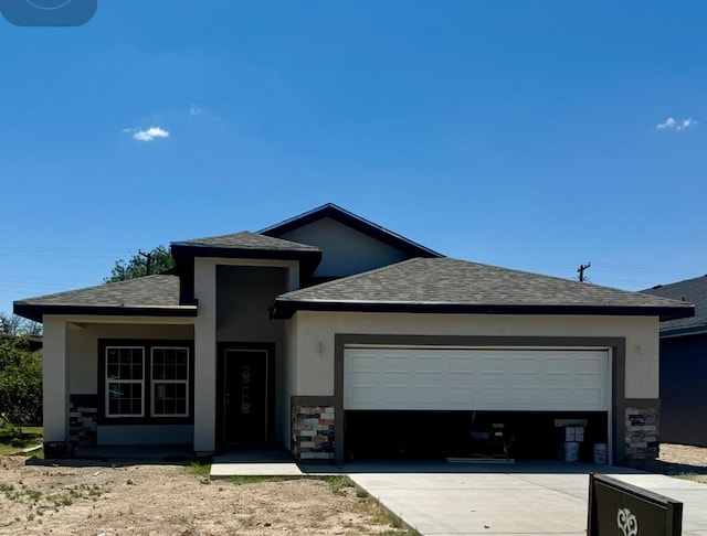 view of front of house with an attached garage, stone siding, concrete driveway, and stucco siding