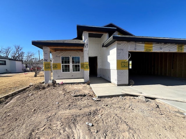 view of front of home featuring a garage and stucco siding