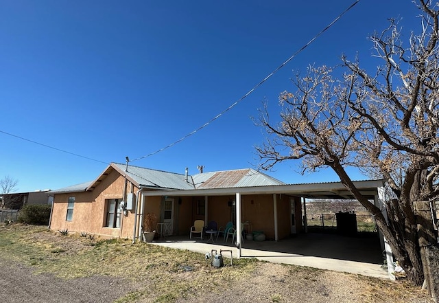 exterior space featuring a carport