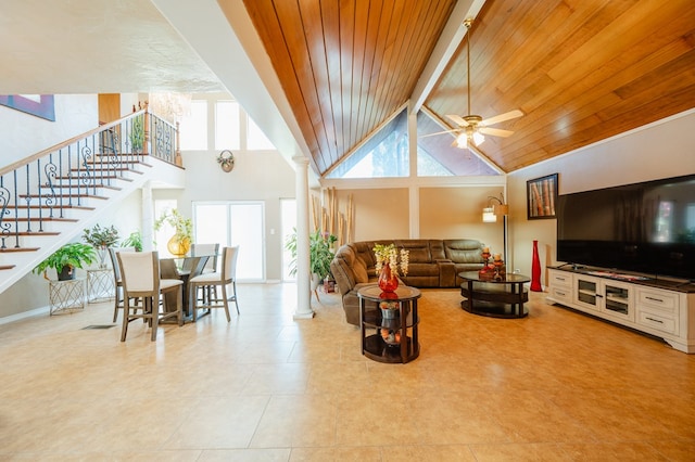 tiled living room featuring beam ceiling, high vaulted ceiling, ceiling fan, and wooden ceiling