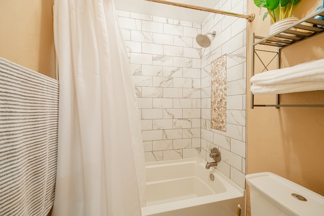 bathroom featuring shower / bathtub combination with curtain and toilet