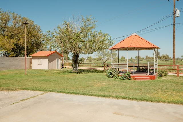 view of yard featuring a gazebo and a storage shed