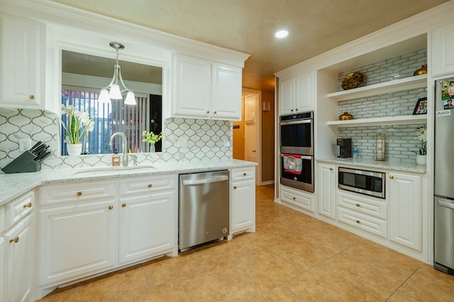 kitchen with tasteful backsplash, white cabinetry, sink, and stainless steel appliances