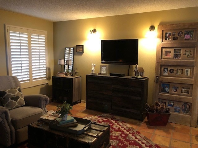 tiled living room with a textured ceiling