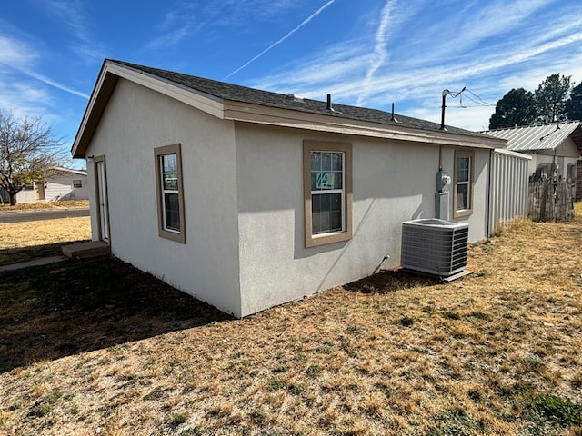 view of home's exterior featuring central AC unit