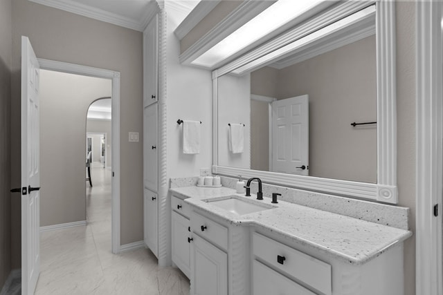 bathroom with vanity and crown molding