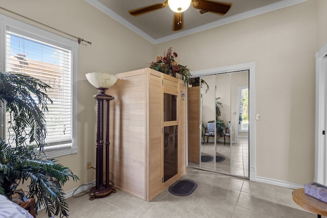 interior space featuring crown molding and light tile patterned floors