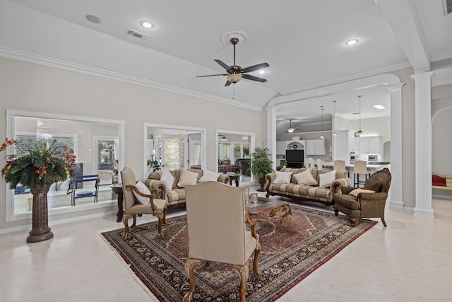 living room with ceiling fan, ornamental molding, high vaulted ceiling, and decorative columns