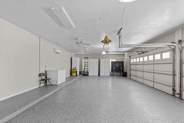 garage with ceiling fan, a garage door opener, and a wall mounted AC