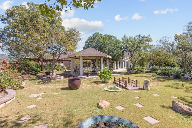 surrounding community with a gazebo and a yard