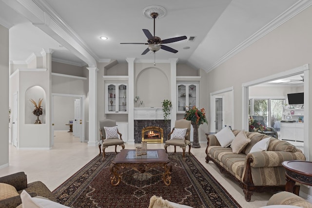 living room with ceiling fan, ornamental molding, a fireplace, and high vaulted ceiling