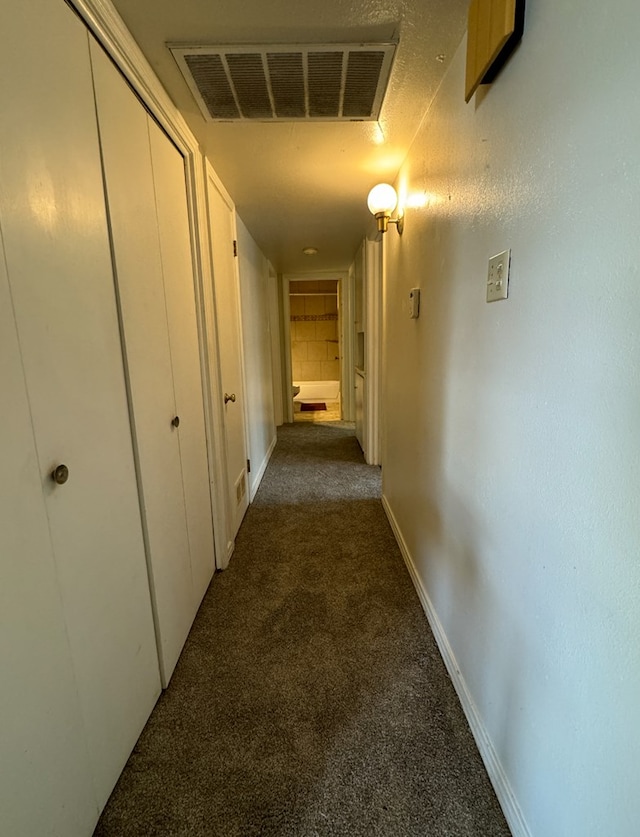 hallway featuring carpet