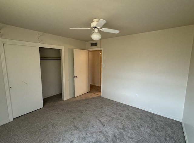 unfurnished bedroom with ceiling fan, a closet, and carpet