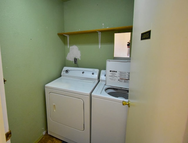 clothes washing area featuring washer and dryer