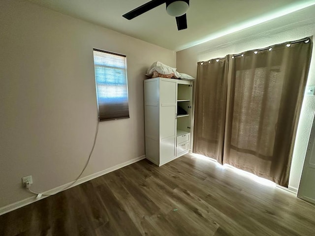 unfurnished bedroom featuring ceiling fan and wood-type flooring