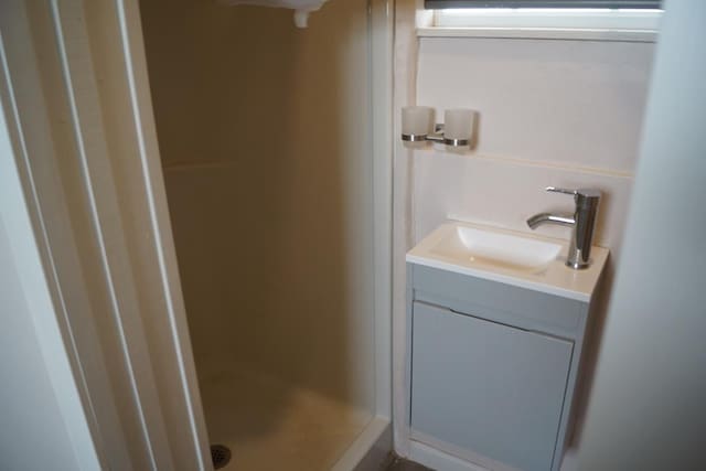 bathroom featuring vanity and walk in shower