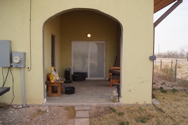 property entrance with a patio