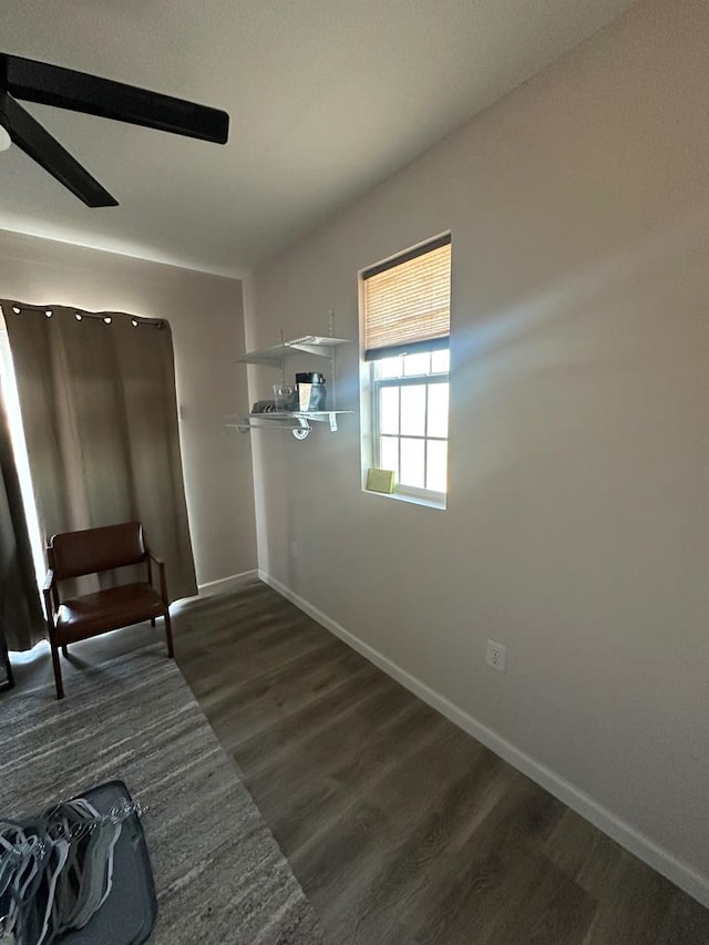 unfurnished room featuring ceiling fan and dark hardwood / wood-style floors