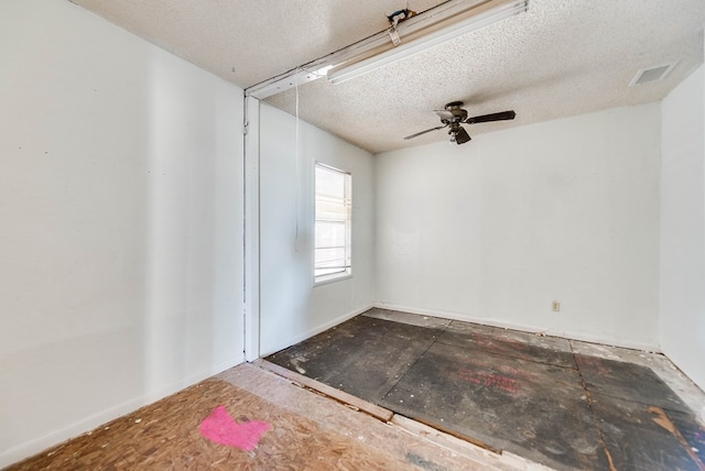 spare room featuring ceiling fan and a textured ceiling